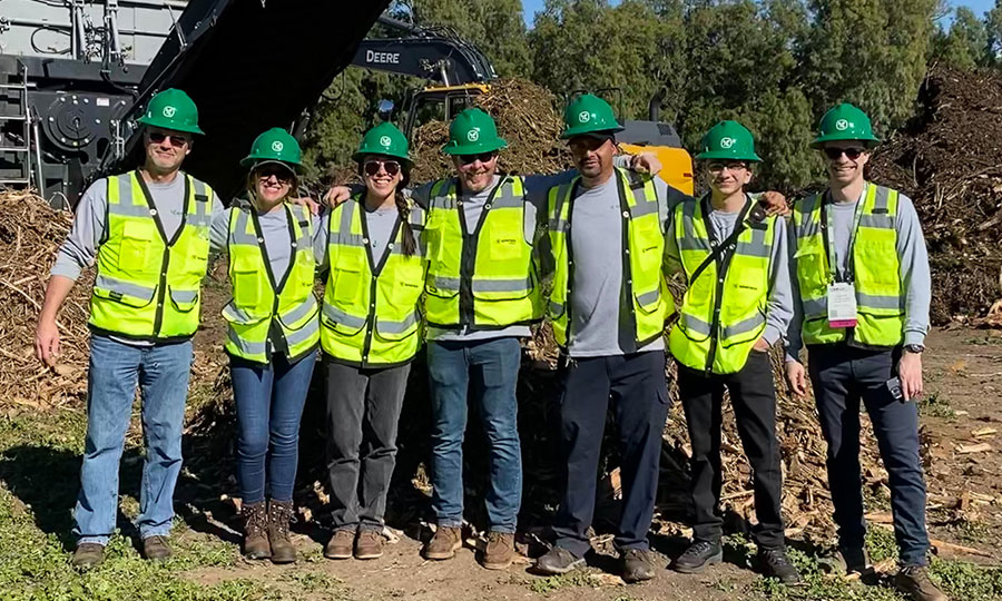 Seven Komptech Americas employees pose for picture at United States Compost Council demo day 2023.