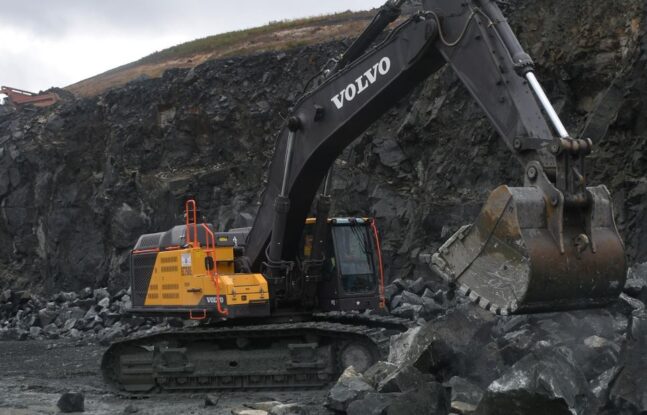 Volvo EC750 excavator moving large rocks at a Maryland quarry