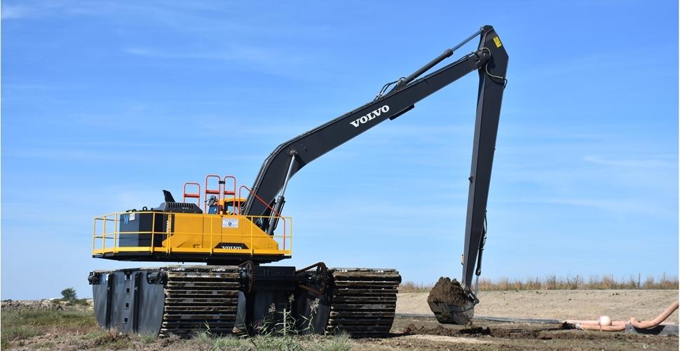 Volvo long-reach excavator digging on Poplar Island in Maryland