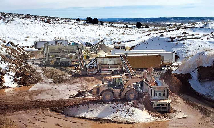 Power Equipment Company aggregate equipment working on a snowy jobsite at a Colorado plant