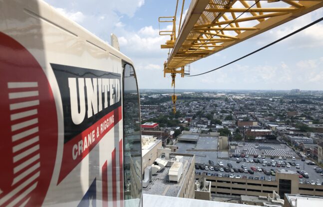 United Crane and Rigging tower crane working above buildings in Maryland