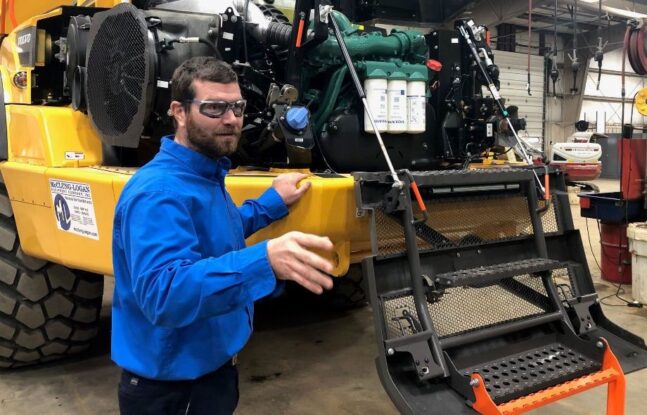 McClung-Logan Technical Support Manager Dan Hensley trains a group of students on Volvo Construction Equipment